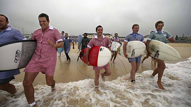 Surfers who are raising money for charity, from left to right, Si Muddell, Nic Claase, Greg Beazley and Will Bigelow at Bondi Beach.