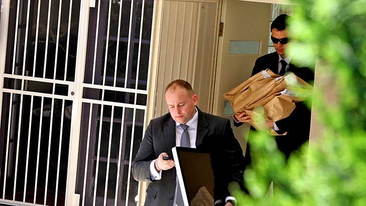 Seeking evidence ... police leave Mr Williamson's Maroubra home.