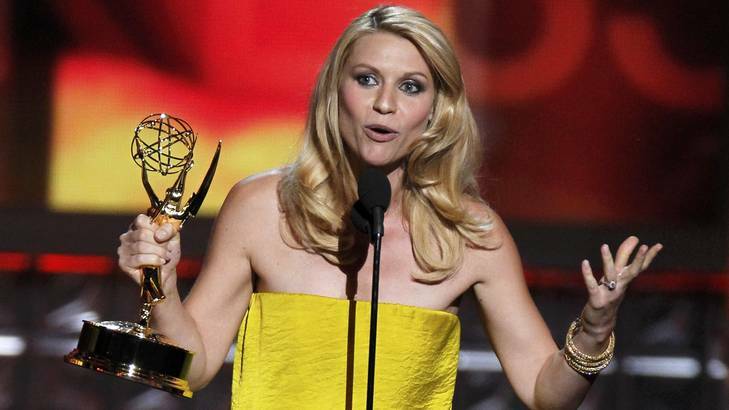 Adopted Aussie? She's wearing gold, or maybe wattle yellow ... Claire Danes accepts her award